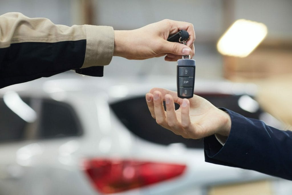 Giving Car Keys To Owner